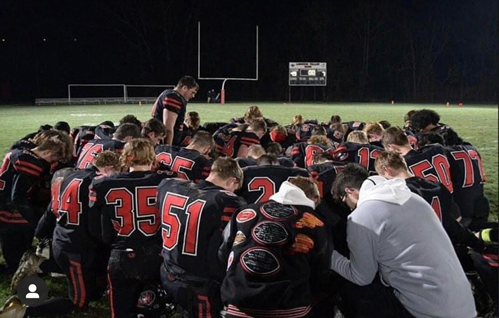 Alex-leading-prayer-after-a-game